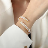 Flat lay of Celestia bracelet beside a velvet pouch